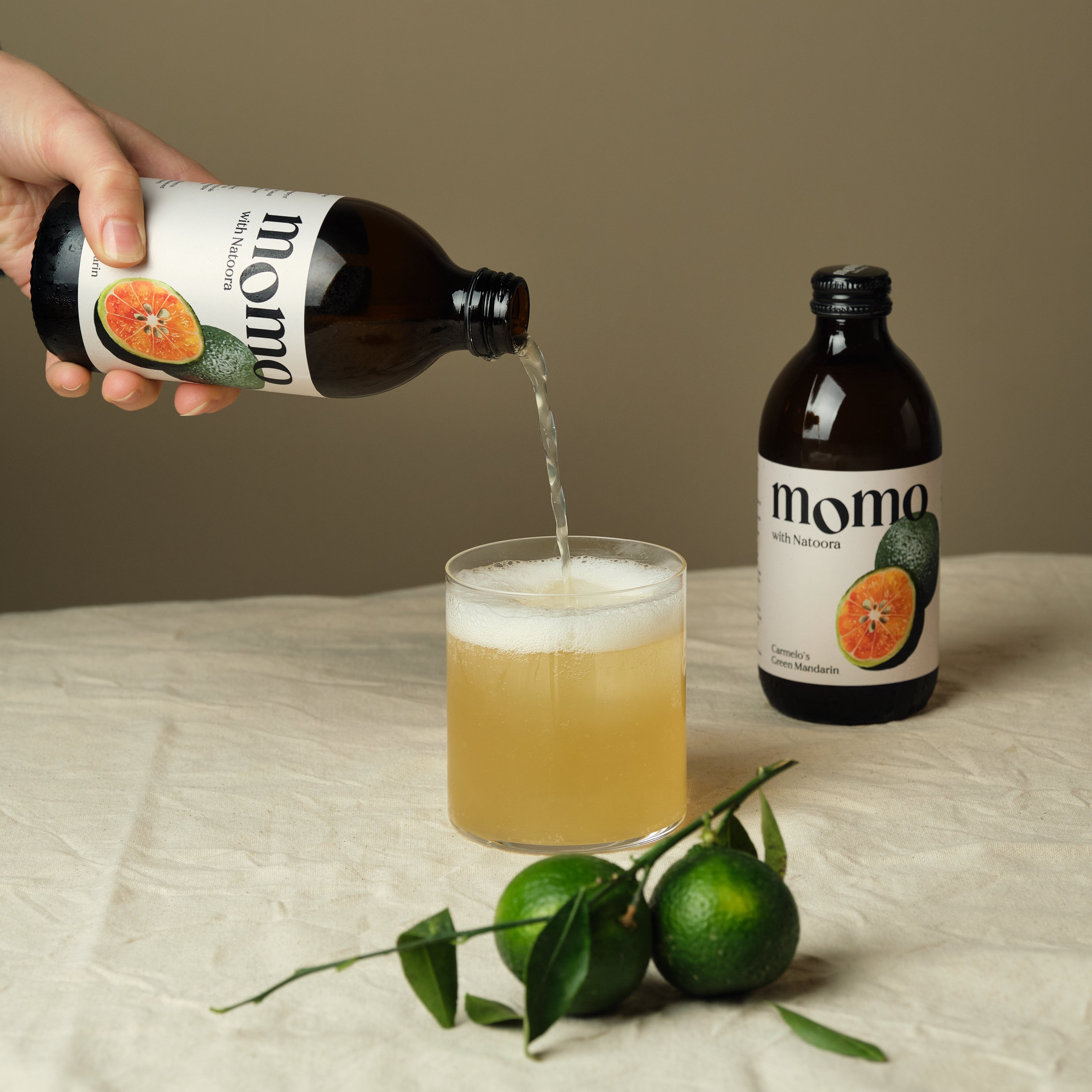 Momo Kombucha and Natoora Revive Seasonal Partnership with Green Mandarin Release